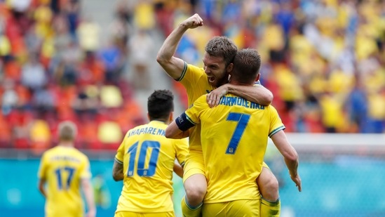 Soccer Football - Euro 2020 - Group C - Ukraine v North Macedonia - National Arena, Bucharest, Romania - June 17, 2021 Ukraine's Andriy Yarmolenko celebrates scoring their first goal with teammates Pool via REUTERS/Robert Ghement (Pool via REUTERS)