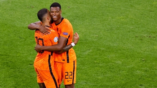Netherlands' Denzel Dumfries celebrates scoring their second goal with Memphis Depay. (Pool via REUTERS)