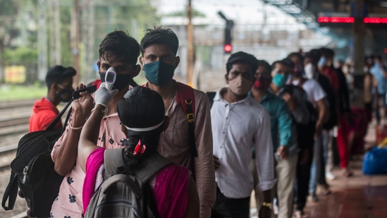 The capital city of Mumbai reported 660 new infections and 20 more deaths taking the city’s cases tally to 717,832 and the death toll rose to 15,247. In picture - Temperature screening before Covid-19 test of passengers at Dadar station in Mumbai. (HT Photo )