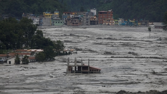 Partially submerged houses are seen as floodwater from the swollen Melamchi river enters the village in Sindhupalchok, on June 16. One of the epicentres of the 2015 earthquake, Sindhupalchok has been witnessing damages due to floods and landslides on an annual basis. With the onset of the monsoon in the Himalayan nation, incidents of floods and landslides are expected to rise further.(Navesh Chitrakar / REUTERS)