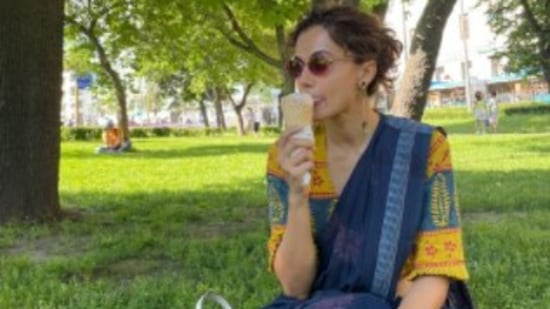 Relaxing on a sunny day with a cone of ice cream in her hand, Taapsee shared a candid picture of herself from her day-3 in Moscow.. (Instagram/@taapsee)