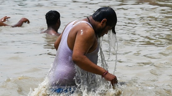 People take a dip in the Ganga Canal during a hot summer day in Muradnagar in Ghaziabad on June 16, 2021. (Representational)(AFP)