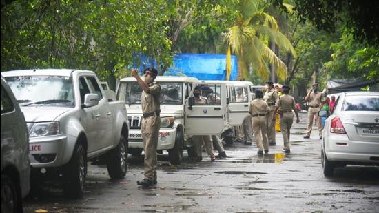 A team of NIA in front of the residence of Pradeep Sharma in Mumbai’s Andheri (east) area on Thursday morning. (Vijay Bate/HT Photo) A team of NIA in front of the residence of Pradeep Sharma in Mumbai’s Andheri (east) area on Thursday morning. (Vijay Bate/HT Photo)