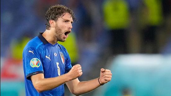 Italy's midfielder Manuel Locatelli celebrates scoring the team's first goal during the UEFA EURO 2020 Group A football match against Switzerland at the Olympic Stadium in Rome. (AFP)