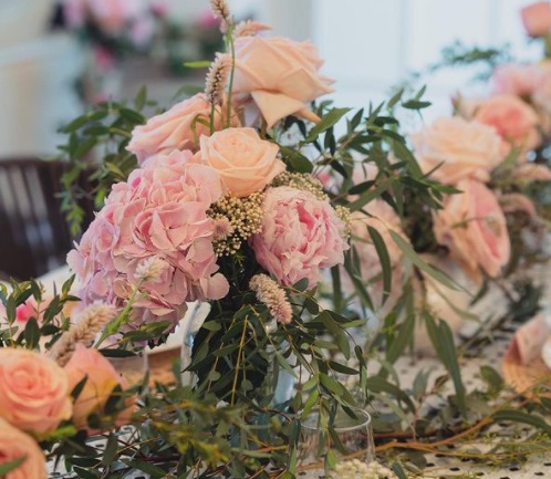 For Lisa Haydon's baby shower white and pink flowers adorned the room.