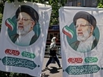 An Iranian woman walks past banners of ultraconservative cleric and presidential candidate Ebrahim Raisi, in Tehran, on June 17, 2021, on the eve of the Islamic republic's presidential election. (ATTA KENARE / AFP) An Iranian woman walks past banners of ultraconservative cleric and presidential candidate Ebrahim Raisi, in Tehran, on June 17, 2021, on the eve of the Islamic republic's presidential election. (ATTA KENARE / AFP)