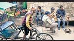 Men at a street corner. (Roberto Schimidt/AFP via Getty Images) Men at a street corner. (Roberto Schimidt/AFP via Getty Images)