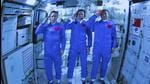 Chinese astronauts salute after successfully entering the Tianhe space station module on Thursday. (AP) Chinese astronauts salute after successfully entering the Tianhe space station module on Thursday. (AP)
