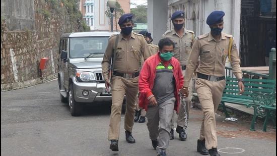 Charani Nilu, the accused in the Kotkhai rape and murder in Shimla being taken away by cops on Friday. (Deepak Sansta/HT) Charani Nilu, the accused in the Kotkhai rape and murder in Shimla being taken away by cops on Friday. (Deepak Sansta/HT)