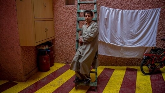 Babloo Shiekh, a transgender Kashmiri, sits for a photograph at home in Srinagar, Kashmir, Wednesday, June 2, 2021. Babloo is one of the head transgenders, one of the few who live with family. Most of Kashmir's transgender people are ostracized by families and bullied in society. (AP) Babloo Shiekh, a transgender Kashmiri, sits for a photograph at home in Srinagar, Kashmir, Wednesday, June 2, 2021. Babloo is one of the head transgenders, one of the few who live with family. Most of Kashmir's transgender people are ostracized by families and bullied in society. (AP)