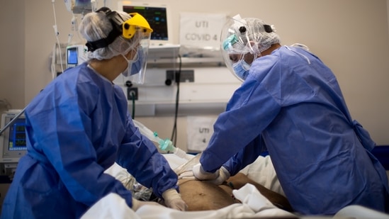 ICU doctors Maria Kopytko and Eduardo Echavarria perform CPR to a patient before he died at the Covid-19 ICU at Llavallol Hospital on June 03 in Lomas de Zamora, Buenos Aires, Argentina. The top five countries by total number of deaths – the United States, Brazil, India, Russia and Mexico – represent about 50% of all deaths in the world, while Peru, Hungary, Bosnia, the Czech Republic and Gibraltar have the highest death rates when adjusted for population.(Tomas Cuesta / Getty Images)