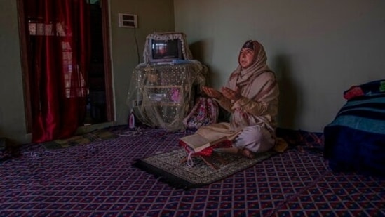 35-year-old transgender Kashmiri Shabnam Ganie prays at home in Srinagar, Kashmir, Friday, May 28, 2021. Shabnam is one of the few fortunate transgenders who own a home, where she lives with an adopted son. Life has not been easy for many of Kashmir's transgender people.. (AP) 35-year-old transgender Kashmiri Shabnam Ganie prays at home in Srinagar, Kashmir, Friday, May 28, 2021. Shabnam is one of the few fortunate transgenders who own a home, where she lives with an adopted son. Life has not been easy for many of Kashmir's transgender people.. (AP)