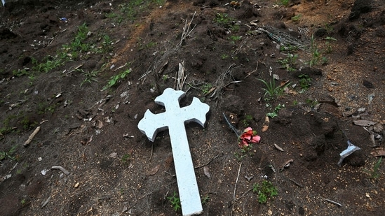 Graves for Covid-19 victims are seen at the La Verbena cemetery in Guatemala City, on June 17. Many health experts believe that official death toll to be undercounted globally, with the World Health Organization (WHO) last month estimating fatalities to be much higher. As poorer nations struggle to inoculate their populations due to vaccine shortages, wealthier countries have been urged to donate more to control the pandemic.(Johan Ordonez / AFP)