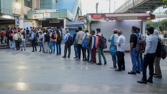 Noida: Long queue at Botanical Garden metro station during peak hours after further ease in Covid-19 lockdown restrictions in Noida, Wednesday, June 16, 2021. (PTI) Noida: Long queue at Botanical Garden metro station during peak hours after further ease in Covid-19 lockdown restrictions in Noida, Wednesday, June 16, 2021. (PTI)