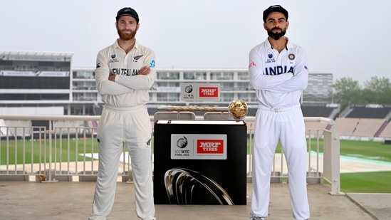 Indian cricket team captain Virat Kohli and his New Zealand counterpart Kane Williamson pose for a photograph with the World Test Championship (WTC) trophy(PTI)