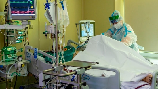 A medic wearing special suit to protect against coronavirus treats a patient with coronavirus in Moscow, Russia. (AP) A medic wearing special suit to protect against coronavirus treats a patient with coronavirus in Moscow, Russia. (AP)