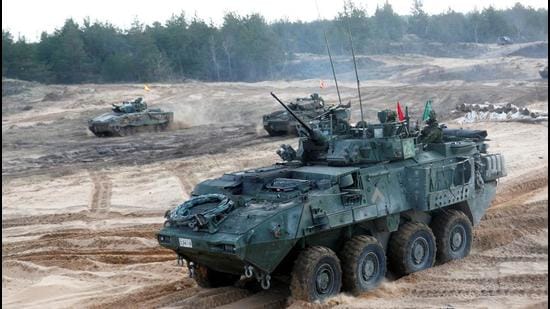 A Canadian Army LAV infantry fighting vehicle and Spanish Army Leopard 2 tanks take part in NATO enhanced Forward Presence battle group military exercise Crystal Arrow 2021 in Adazi, Latvia. (REUTERS) A Canadian Army LAV infantry fighting vehicle and Spanish Army Leopard 2 tanks take part in NATO enhanced Forward Presence battle group military exercise Crystal Arrow 2021 in Adazi, Latvia. (REUTERS)