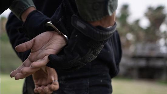 A U.S. border patrol agent handcuffs a migrant woman after she was found hiding in thick brush after crossing the Rio Grande river into the United States from Mexico in La Joya, Texas, U.S., May 18, 2021. REUTERS/Adrees Latif (REUTERS) A U.S. border patrol agent handcuffs a migrant woman after she was found hiding in thick brush after crossing the Rio Grande river into the United States from Mexico in La Joya, Texas, U.S., May 18, 2021. REUTERS/Adrees Latif (REUTERS)