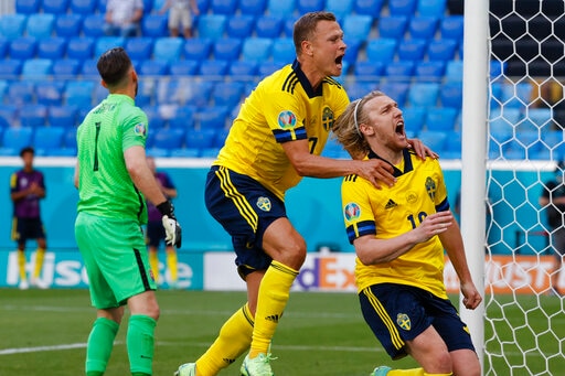 Sweden's Emil Forsberg, right, celebrates with teammate Viktor Claesson after scoring his side's opening goal during the Euro 2020 soccer championship group E match between Sweden and Slovakia, at the Saint Petersburg stadium, in Saint Petersburg, Russia, Friday, June 18, 2021. (Anatoly Maltsev, Pool via AP) Sweden's Emil Forsberg, right, celebrates with teammate Viktor Claesson after scoring his side's opening goal during the Euro 2020 soccer championship group E match between Sweden and Slovakia, at the Saint Petersburg stadium, in Saint Petersburg, Russia, Friday, June 18, 2021. (Anatoly Maltsev, Pool via AP)
