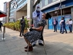 A healthcare worker collects a swab sample from a woman during a rapid antigen testing campaign for coronavirus disease (Covid-19), outside a shopping mall in Mumbai.