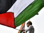 A boy waves a Palestine flag. (Sanchit Khanna/HT PHOTO) A boy waves a Palestine flag. (Sanchit Khanna/HT PHOTO)