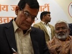 Former IAS officer Arvind Kumar Sharma joining the BJP at party office in Lucknow on January 14. Former IAS officer Arvind Kumar Sharma joining the BJP at party office in Lucknow on January 14.