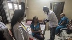 A beneficiary (centre) gets her Covid-19 vaccine jab at her home during the door-to-door vaccination drive at Shaniwar Peth in Pune. (HT file photo) A beneficiary (centre) gets her Covid-19 vaccine jab at her home during the door-to-door vaccination drive at Shaniwar Peth in Pune. (HT file photo)