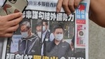 A supporter of two executives from Hong Kong's pro-democracy Apple Daily newspaper, chief editor Ryan Law and CEO Cheung Kim-hung, holds up a copy of the newspaper during a protest outside court in Hong Kong.(AFP) A supporter of two executives from Hong Kong's pro-democracy Apple Daily newspaper, chief editor Ryan Law and CEO Cheung Kim-hung, holds up a copy of the newspaper during a protest outside court in Hong Kong.(AFP)