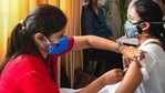 A healthcare worker administers Covid-19 vaccine dose to a student at a vaccination centre, in Delhi (PTI Photo). A healthcare worker administers Covid-19 vaccine dose to a student at a vaccination centre, in Delhi (PTI Photo).