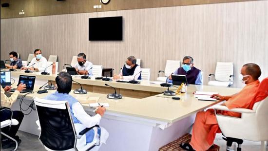Uttar Pradesh chief minister Yogi Adityanath at a Covid review meeting. (PTI FILE PHOTO) Uttar Pradesh chief minister Yogi Adityanath at a Covid review meeting. (PTI FILE PHOTO)