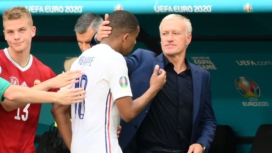 France coach Didier Deschamps and Kylian Mbappe after the match. (Pool via REUTERS)