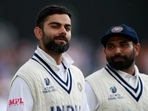 India's Mohammed Shami, right, watches as captain Virat Kohli gestures jokingly as they leave the field at the end of play on the third day of the World Test Championship final cricket match.(AP)