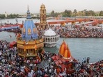 Devotees gather for a prayer during the Kumbh fair in April. REUTERS(HT_PRINT) Devotees gather for a prayer during the Kumbh fair in April. REUTERS(HT_PRINT)