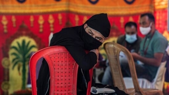A person waits to see a doctor during a free medical camp for transgender persons organized by a voluntary organization in Srinagar. (AP) A person waits to see a doctor during a free medical camp for transgender persons organized by a voluntary organization in Srinagar. (AP)