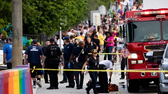 Police and firefighters respond after a truck drove into a crowd of people during The Stonewall Pride Parade and Street Festival in Wilton Manors on June 19, 2021(South Florida Sun-Sentinel via AP)