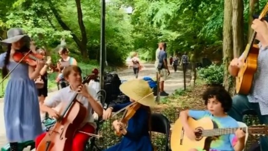 The image shows members of The Quarantined Quartet and The Happy Caravan at New York's Central Park.(Instagram/@cellodude06)