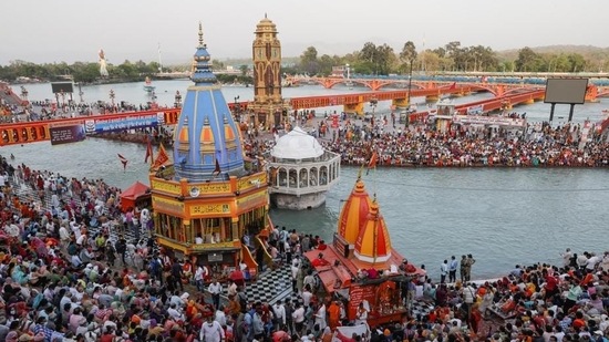 Devotees gather for a prayer during the Kumbh fair in April. REUTERS(HT_PRINT) Devotees gather for a prayer during the Kumbh fair in April. REUTERS(HT_PRINT)