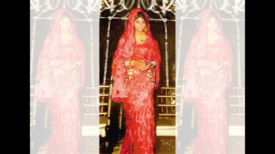 Ritu in her bridal attire wearing bandhani on silk