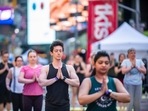 People participate in Solstice in Times Square: Mind Over Madness Yoga, an annual all-day outdoor yoga event in New York's Times Square, Sunday, June 20, 2021. (AP Photo/Brittainy Newman) People participate in Solstice in Times Square: Mind Over Madness Yoga, an annual all-day outdoor yoga event in New York's Times Square, Sunday, June 20, 2021. (AP Photo/Brittainy Newman)