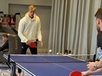 Kyle Jamieson (R) plays table tennis as rain delays fourth day's play in Southampton