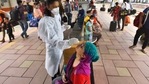 A BMC health worker is collect swab samples for Covid teat of the passengers at Dadar station in Mumbai.(Satish Bate/HT Photo) A BMC health worker is collect swab samples for Covid teat of the passengers at Dadar station in Mumbai.(Satish Bate/HT Photo)