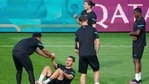Austria's Aleksandar Dragovic gets a hand to stand up while warming up during a training session at the Arcul de Triumf stadium in Bucharest(AP) Austria's Aleksandar Dragovic gets a hand to stand up while warming up during a training session at the Arcul de Triumf stadium in Bucharest(AP)