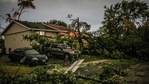 Fallen trees lay in front of a home after a tornado swept through the area in Woodridge, Ill., early Monday morning, June 21, 2021. (AP) Fallen trees lay in front of a home after a tornado swept through the area in Woodridge, Ill., early Monday morning, June 21, 2021. (AP)