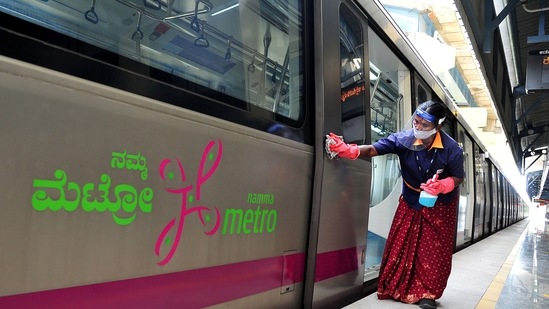 A worker cleans the Metro on Sunday, a day before its reopening, after the Karnataka government gives more relaxations in Covid-19 curbs.(ANI Photo)