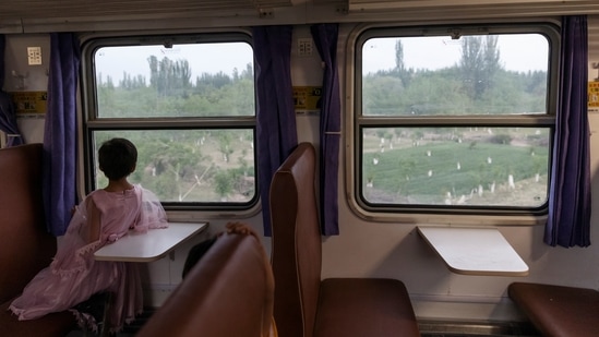 A girl looks out from a train window while travelling from Hotan to Kashgar, Xinjiang Uyghur Autonomous Region, China on May 1. (Thomas Peter / REUTERS) A girl looks out from a train window while travelling from Hotan to Kashgar, Xinjiang Uyghur Autonomous Region, China on May 1. (Thomas Peter / REUTERS)