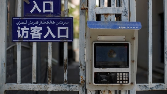 A government installed facial recognition device to grant residents access to their compound is seen at a gate in Urumqi, Xinjiang Uyghur Autonomous Region, China on May 7. In the city streets and countryside of Xinjiang, Communist Party propaganda urges loyalty and ethnic unity. (Thomas Peter / REUTERS) A government installed facial recognition device to grant residents access to their compound is seen at a gate in Urumqi, Xinjiang Uyghur Autonomous Region, China on May 7. In the city streets and countryside of Xinjiang, Communist Party propaganda urges loyalty and ethnic unity. (Thomas Peter / REUTERS)