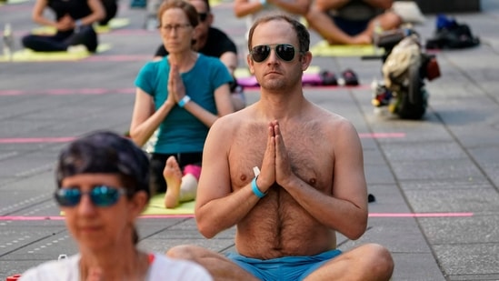 People take part in International Yoga Day. (AFP)