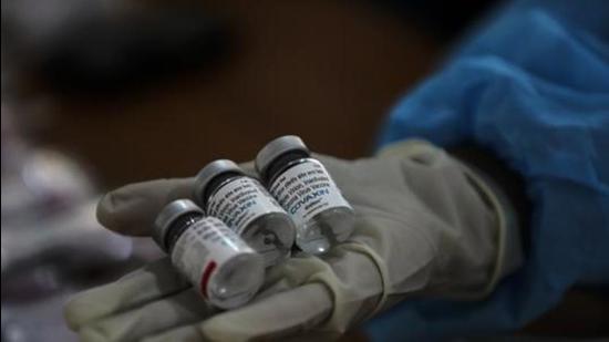 File photo: A health worker displays empty vials of COVAXIN at a vaccination center. (AP)