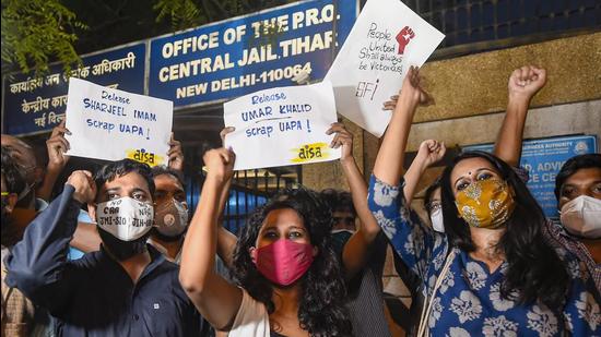 Student activists Natasha Narwal, Devangana Kalita and Asif Iqbal Tanha outside Tihar prison, after a court ordered their immediate release in the north-east Delhi riots "conspiracy" case, in New Delhi, Thursday. (PTI)