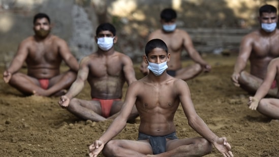 Wrestlers in an akhada performed yoga on Sunday at Sarfabad village, Noida. (Sunil Ghosh/Hindustan Times) Wrestlers in an akhada performed yoga on Sunday at Sarfabad village, Noida. (Sunil Ghosh/Hindustan Times)